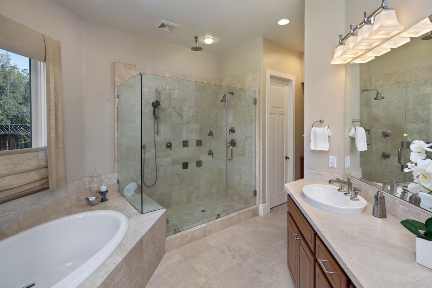 782 Dixon Way Los Altos, CA 94022 - Photo 13 of 38 a spacious bathroom with a tub sink shower and mirror