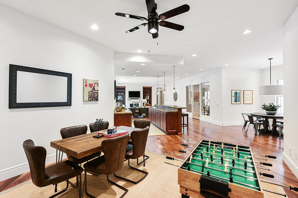 782 Dixon Way Los Altos, CA 94022 - Photo 24 of 38 a living room with furniture a rug kitchen view and a chandelier