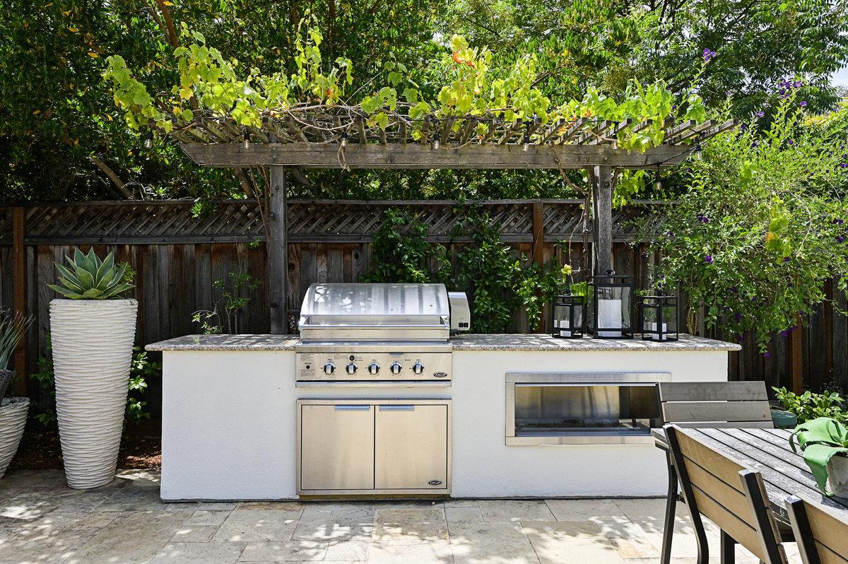 782 Dixon Way Los Altos, CA 94022 - Photo 36 of 38 a view of a patio with table and chairs with wooden fence and plants