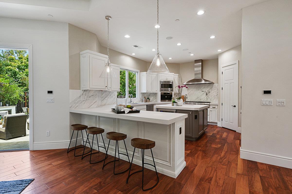 782 Dixon Way Los Altos, CA 94022 - Photo 6 of 38 a kitchen with a sink a center island stainless steel appliances and cabinets
