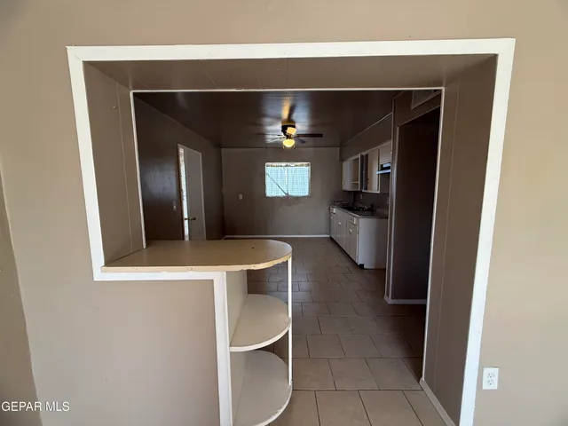 a view of an empty room with windows