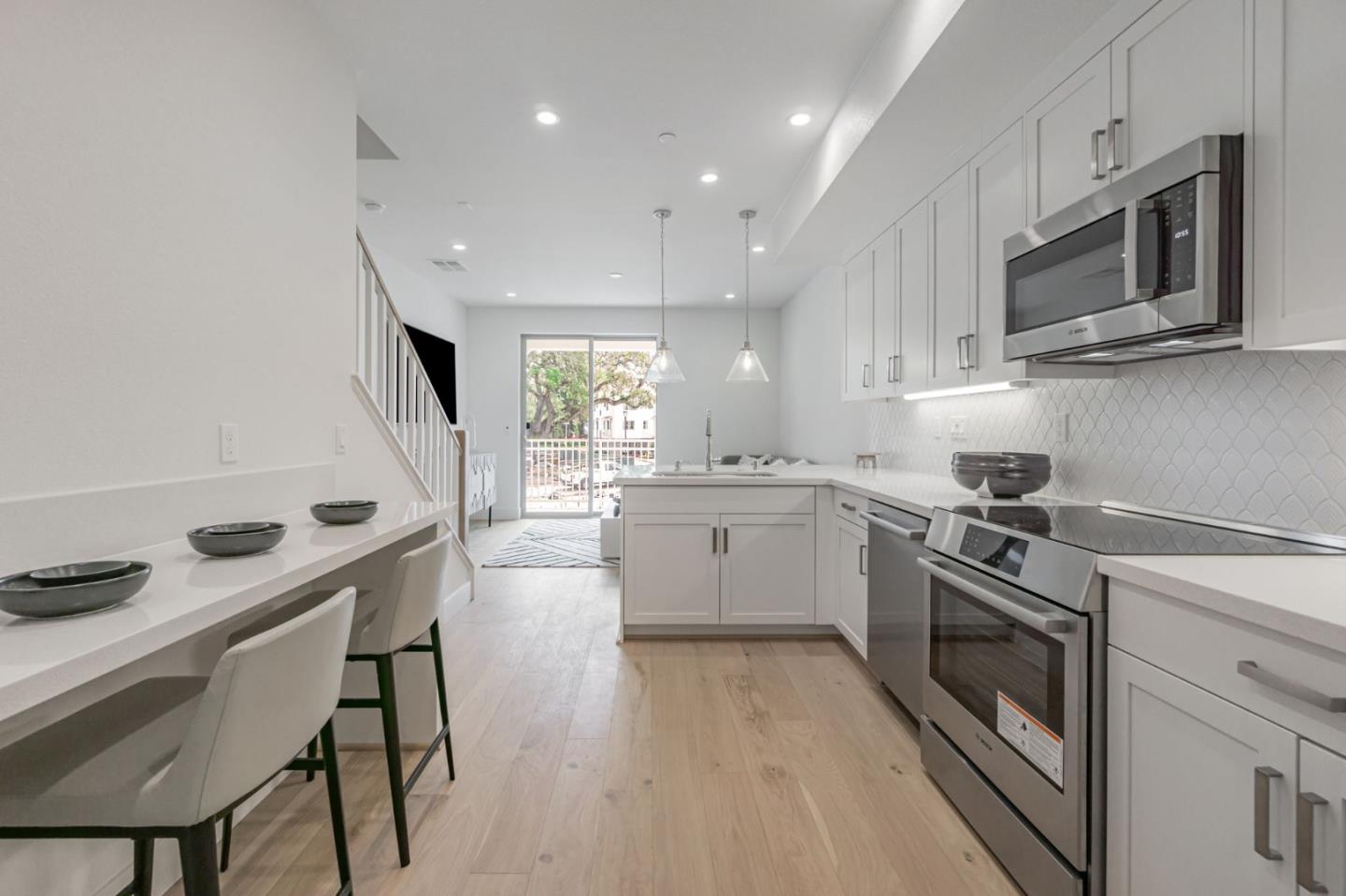146 Oak Circle Walnut Creek, CA 94597 - Photo 2 of 10 a kitchen with a stove a sink and a microwave