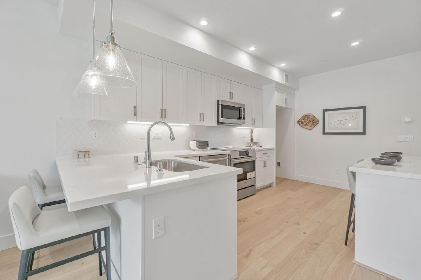 146 Oak Circle Walnut Creek, CA 94597 - Photo 4 of 10 a kitchen with a sink cabinets and window
