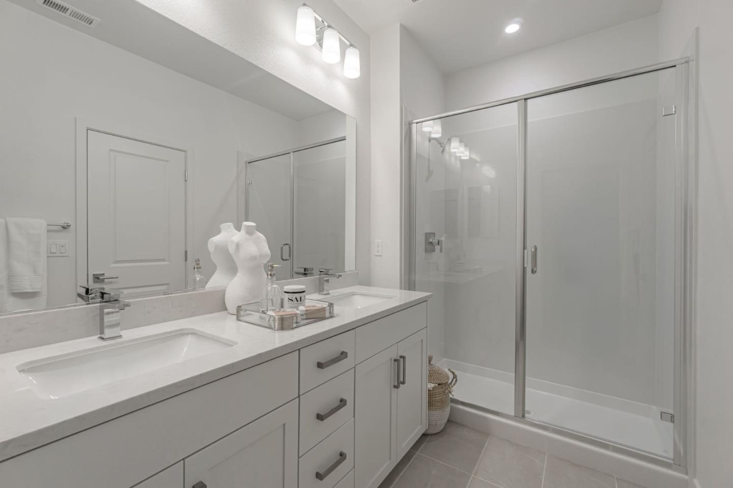 146 Oak Circle Walnut Creek, CA 94597 - Photo 6 of 10 a bathroom with double vanity sink a shower and a mirror