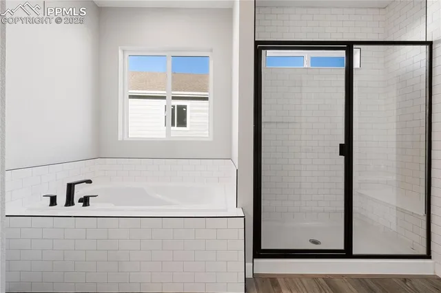 a spacious bathroom with double sink and a mirror