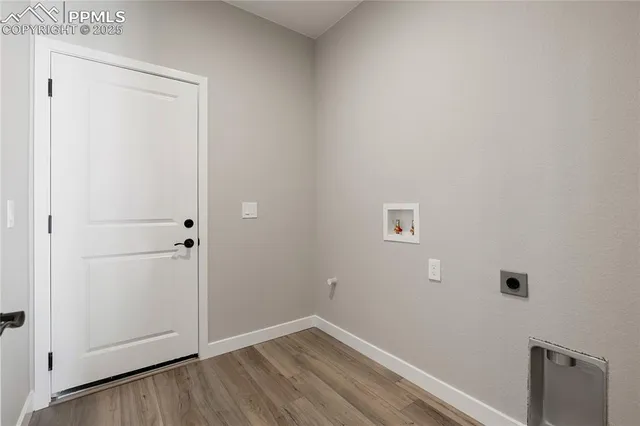 an empty room with a hallway and stairs