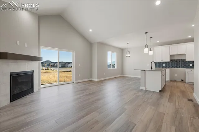 a kitchen with stainless steel appliances a sink a stove and a refrigerator