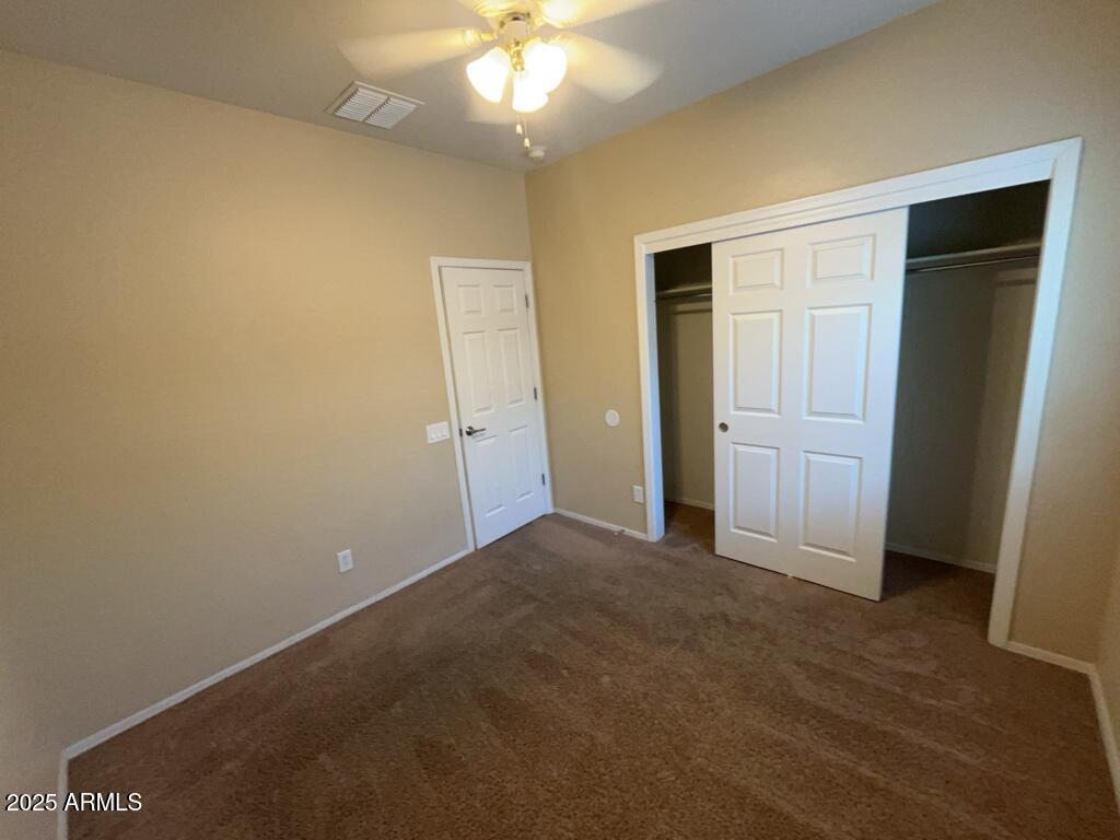11021 East Sutter Avenue Mesa, AZ 85212 - Photo 12 of 26 an empty room with a bathroom