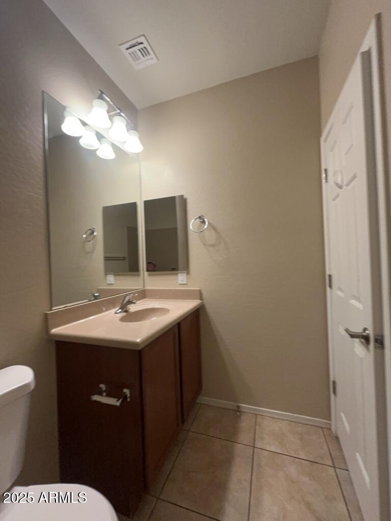 11021 East Sutter Avenue Mesa, AZ 85212 - Photo 13 of 26 a bathroom with a sink and a mirror