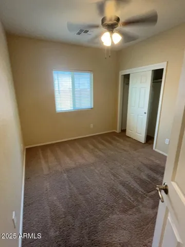 a white toilet sitting next to a bath tub