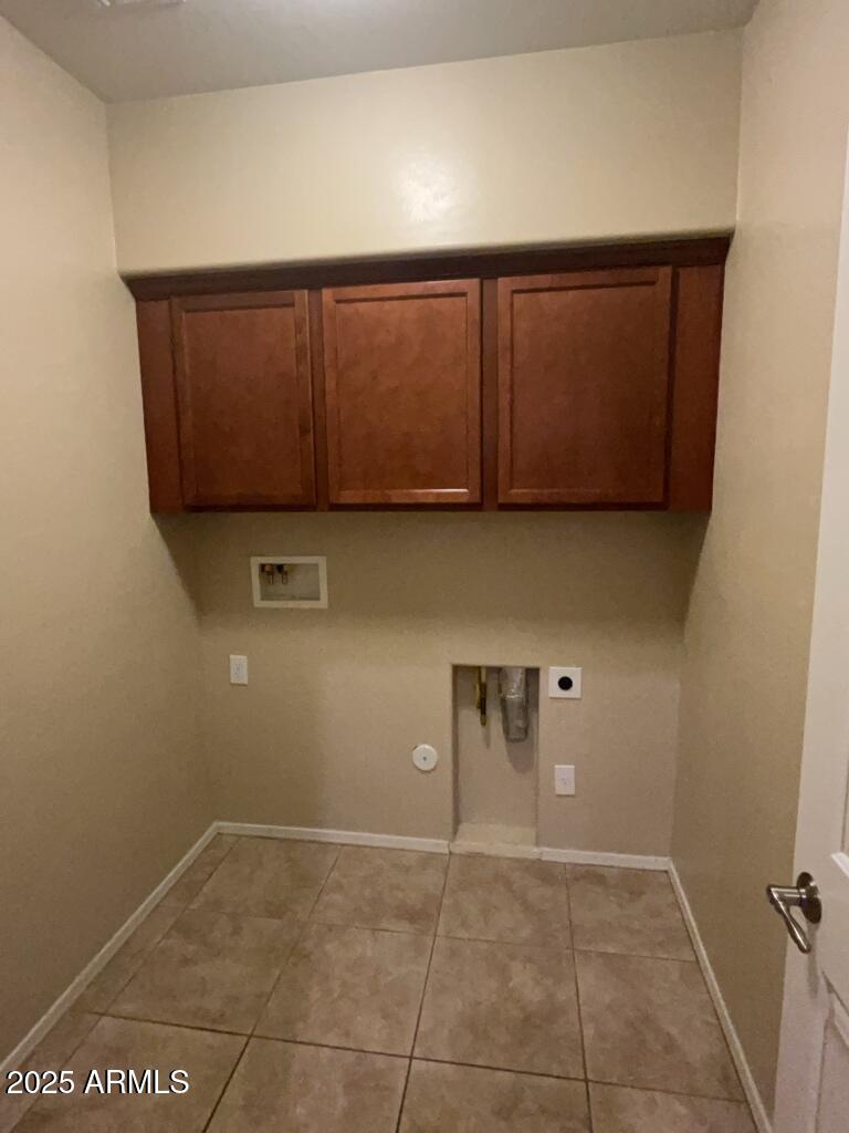 11021 East Sutter Avenue Mesa, AZ 85212 - Photo 22 of 26 a view of a utility room with cabinets