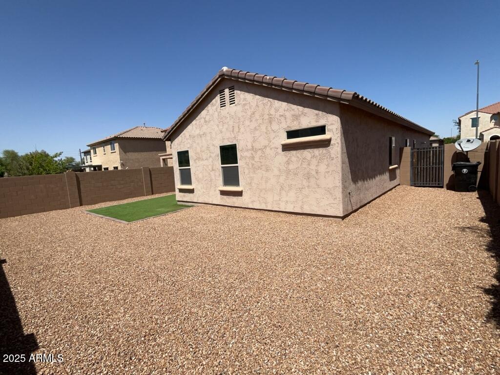 11021 East Sutter Avenue Mesa, AZ 85212 - Photo 24 of 26 a view of a house with a yard