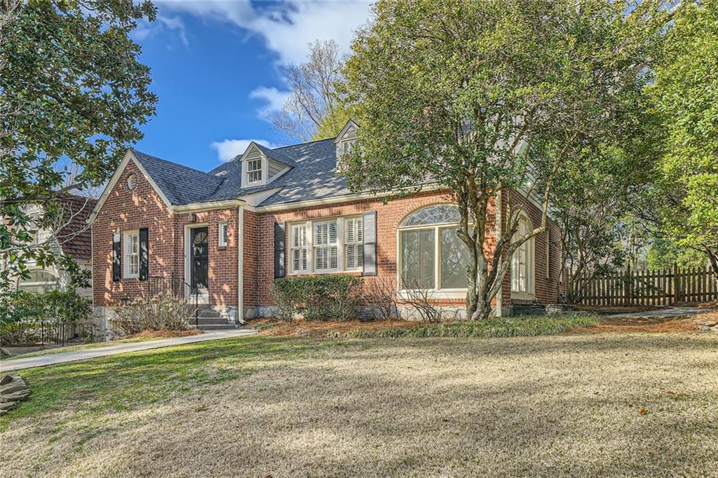 2876 Alpine Road Northeast Atlanta, GA 30305 - Photo 1 of 1 a front view of a house with a yard