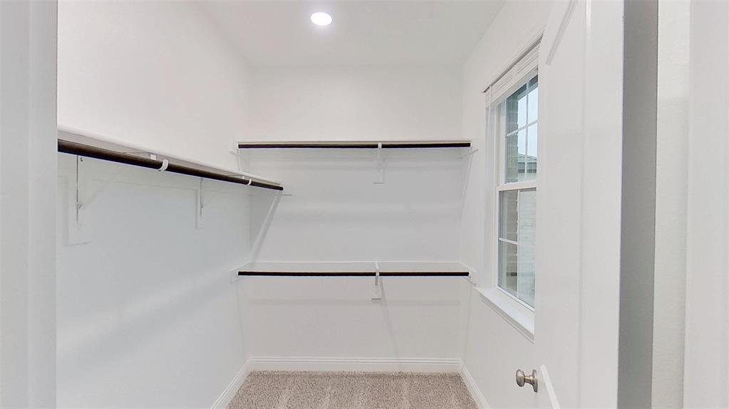 415 Magellan Road Seagoville, TX 75159 - Photo 7 of 14 a view of small space with racks on the wall