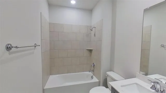 a bathroom with a bathtub and shower