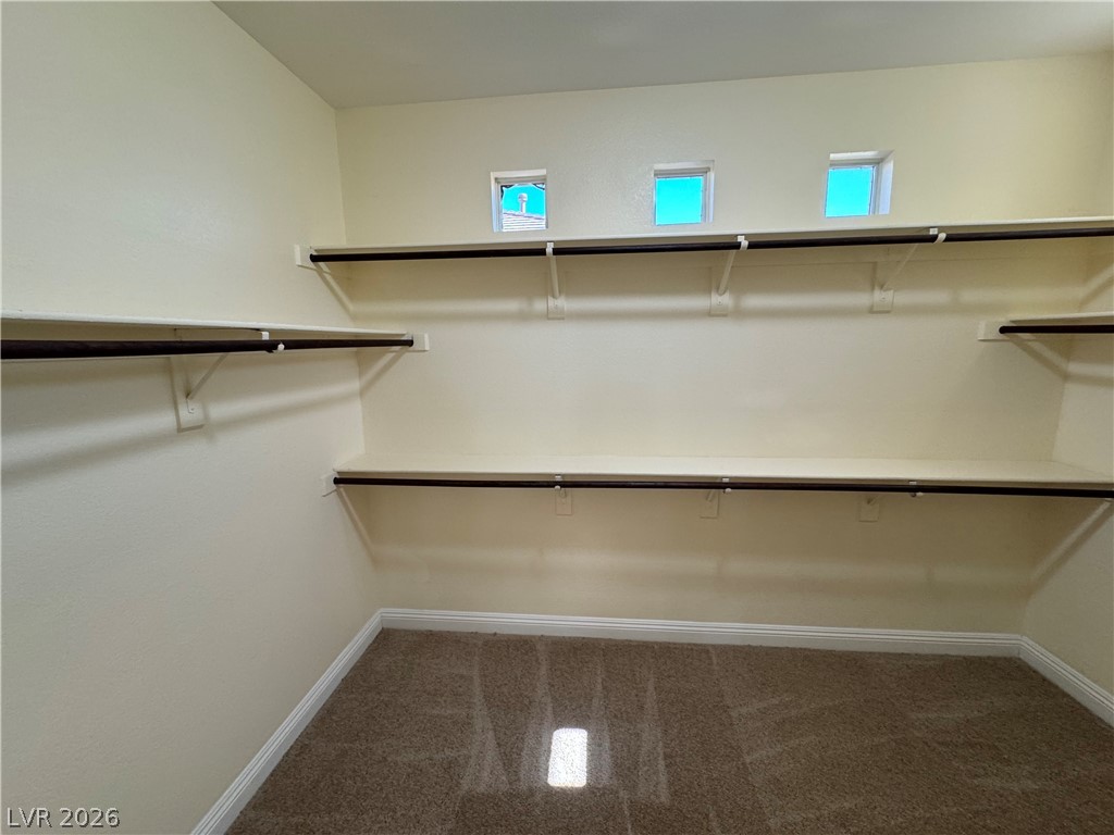 1333 Jamesbury Road Las Vegas, NV 89135 - Photo 36 of 43 Ample shelving and hanging space defines this practical, organized walk-in wardrobe.
