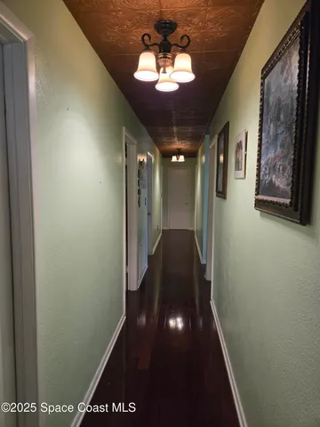 a living room with furniture and a mirror