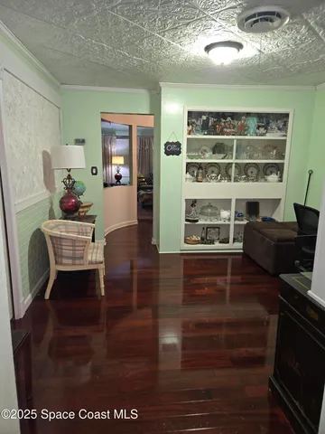a view of living room with furniture and wooden floor