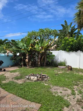 a view of a backyard with a garden
