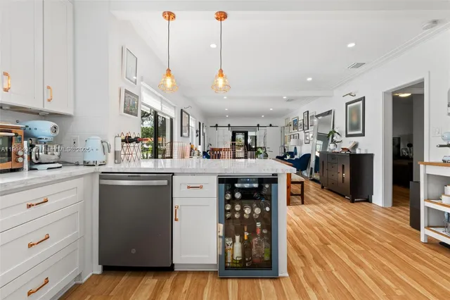 a kitchen with granite countertop a stove and a sink