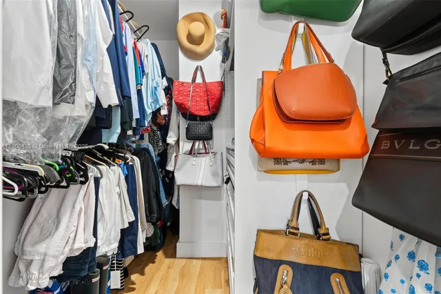 a bedroom with a bed and a chair