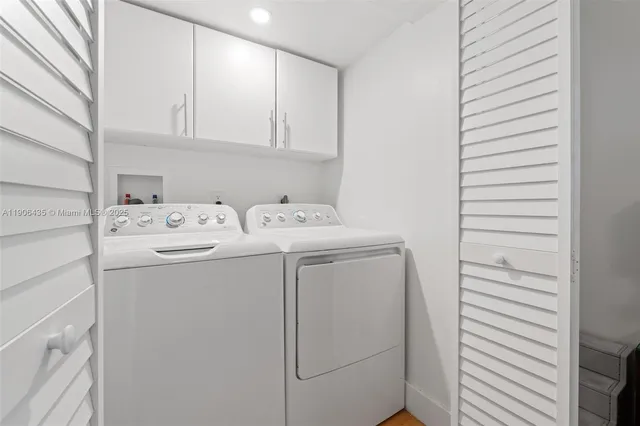 a view of a house with a tree in front of it