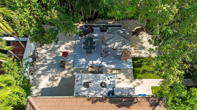 a view of balcony with furniture and umbrella