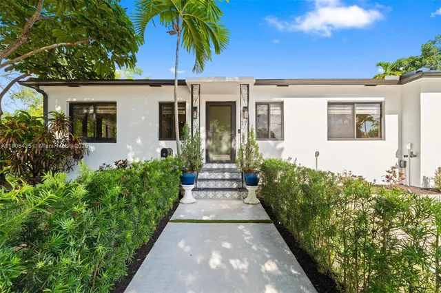 a living room with fireplace furniture and a flat screen tv