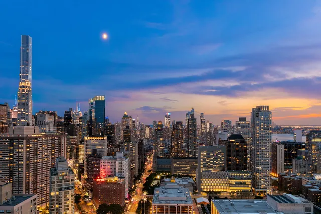 a view of a city with tall buildings