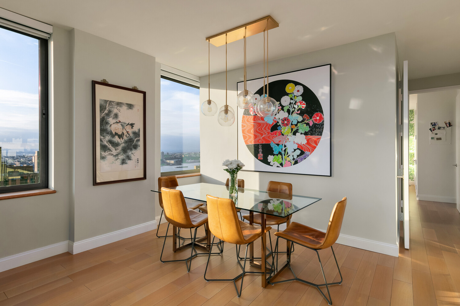 101 West 67th Street, Unit 52E Manhattan, NY 10023 - Photo 7 of 21 a view of a dining room with furniture wooden floor and window