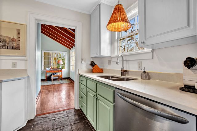 a kitchen with a sink and a stove