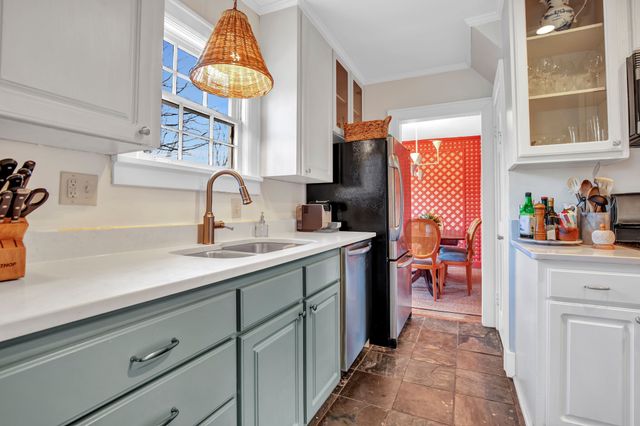 a kitchen with a sink and a window