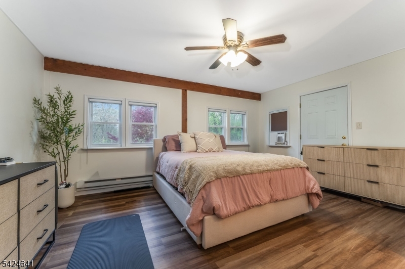 21 Marble Street Washington, NJ 07882 - Photo 12 of 21 a spacious bedroom with a large bed and a window
