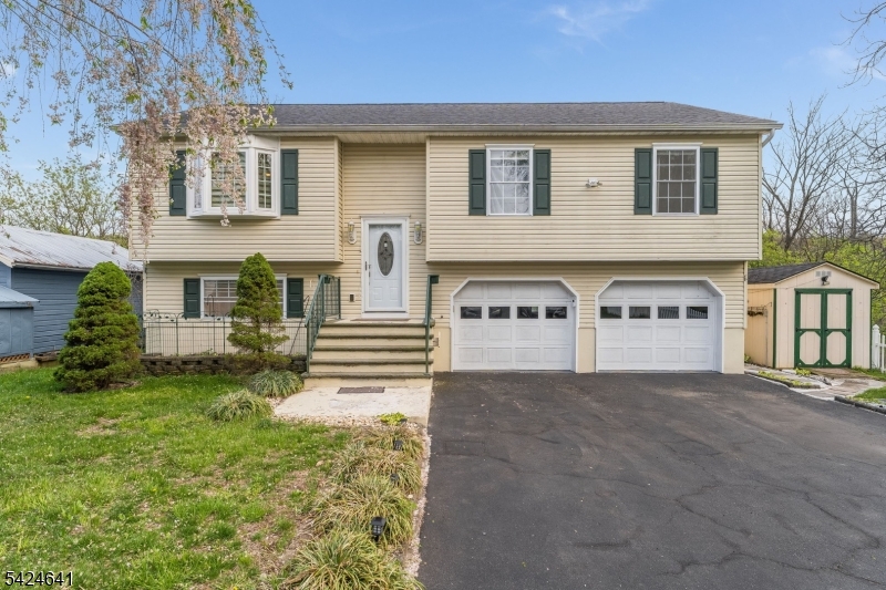 21 Marble Street Washington, NJ 07882 - Photo 2 of 21 a front view of a house with a yard and garage