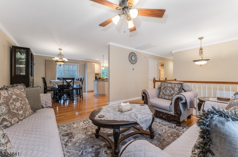 21 Marble Street Washington, NJ 07882 - Photo 4 of 21 a living room with furniture and a chandelier