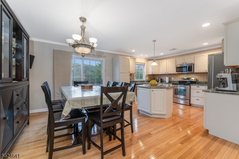 21 Marble Street Washington, NJ 07882 - Photo 6 of 21 a view of a dining room with furniture a kitchen and chandelier