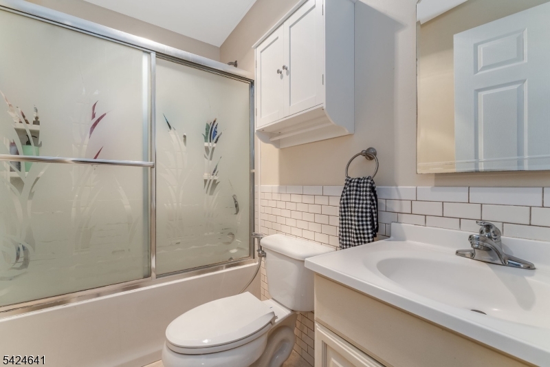 21 Marble Street Washington, NJ 07882 - Photo 7 of 21 a bathroom with a sink a toilet and shower