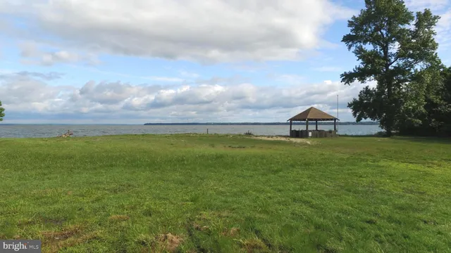 a view of house with garden and deck
