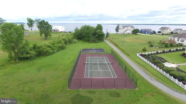 a view of a swimming pool with a yard