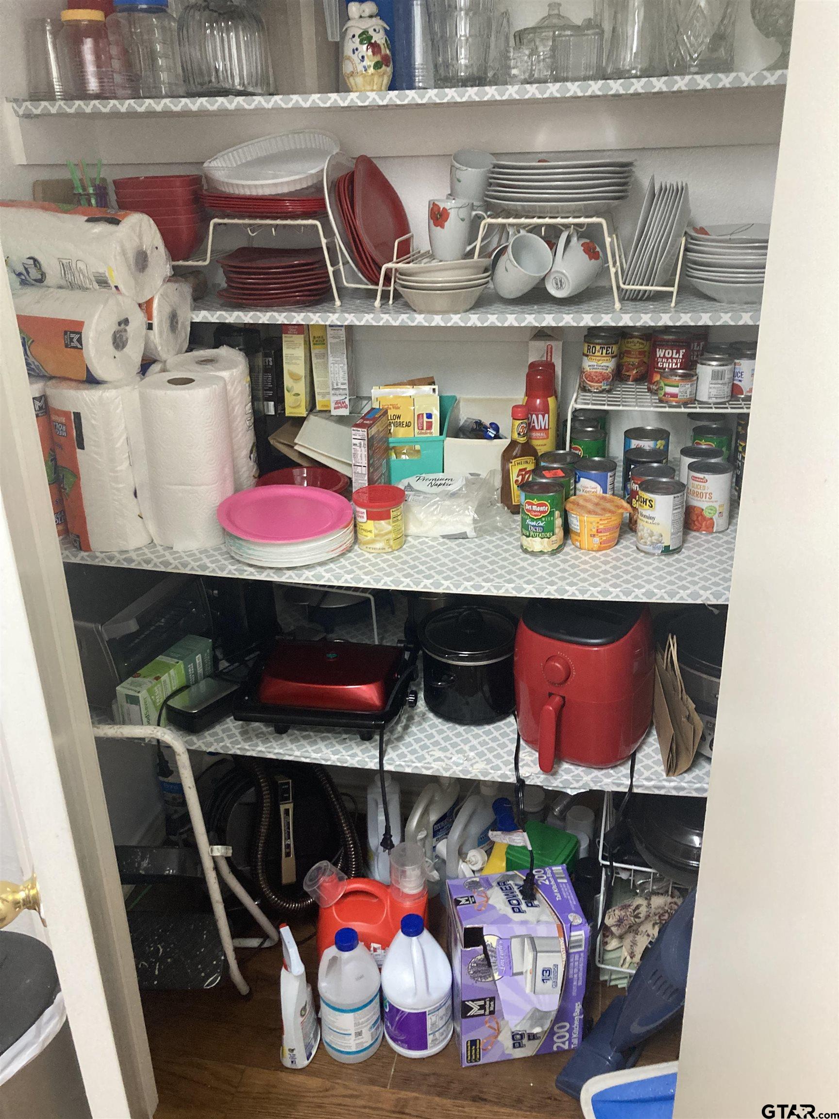 1521 Rice Road, Unit Q103 Tyler, TX 75703 - Photo 11 of 40 a store room with lots of different colored cloths