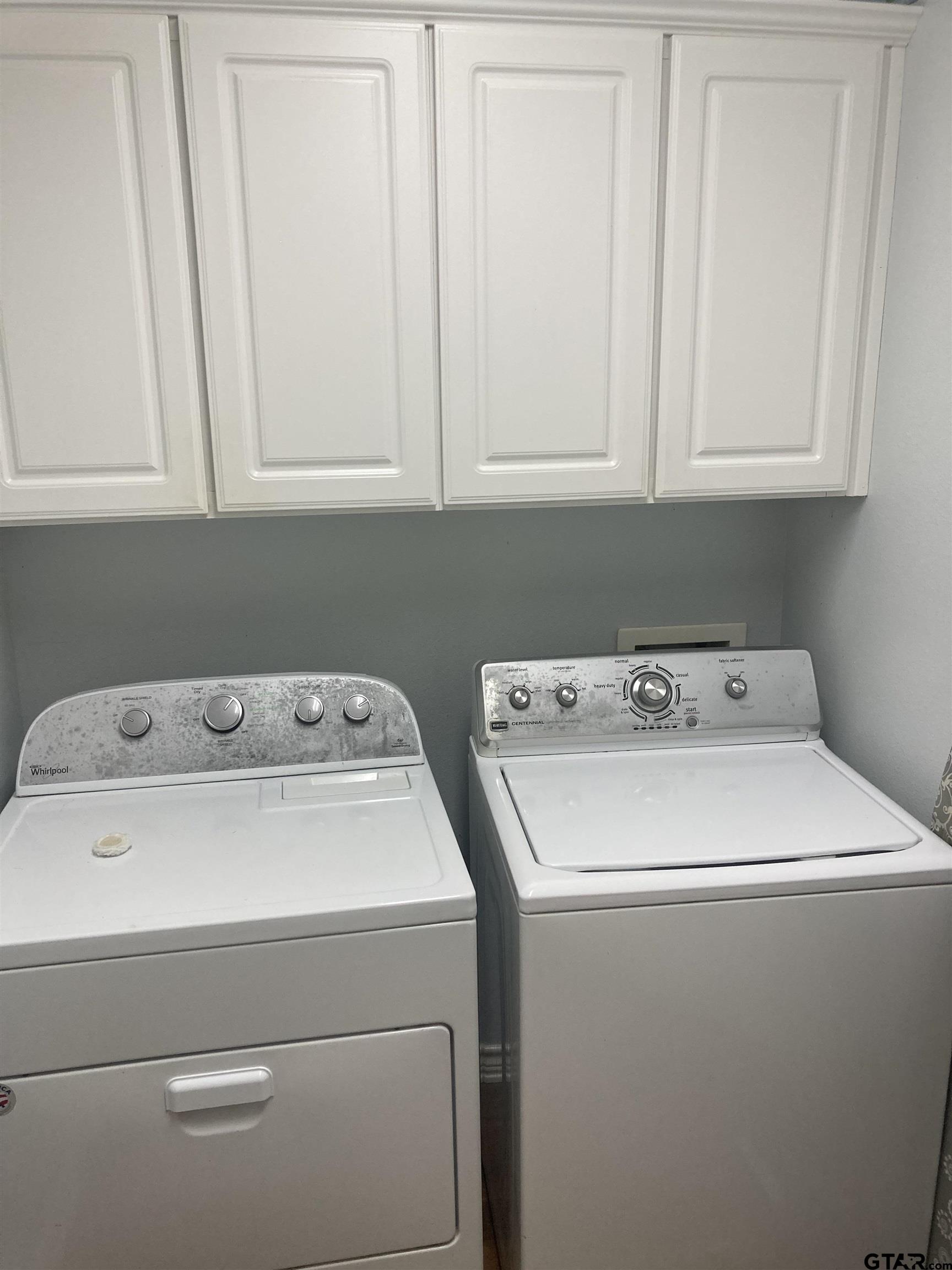 1521 Rice Road, Unit Q103 Tyler, TX 75703 - Photo 12 of 40 a utility room with dryer and washer