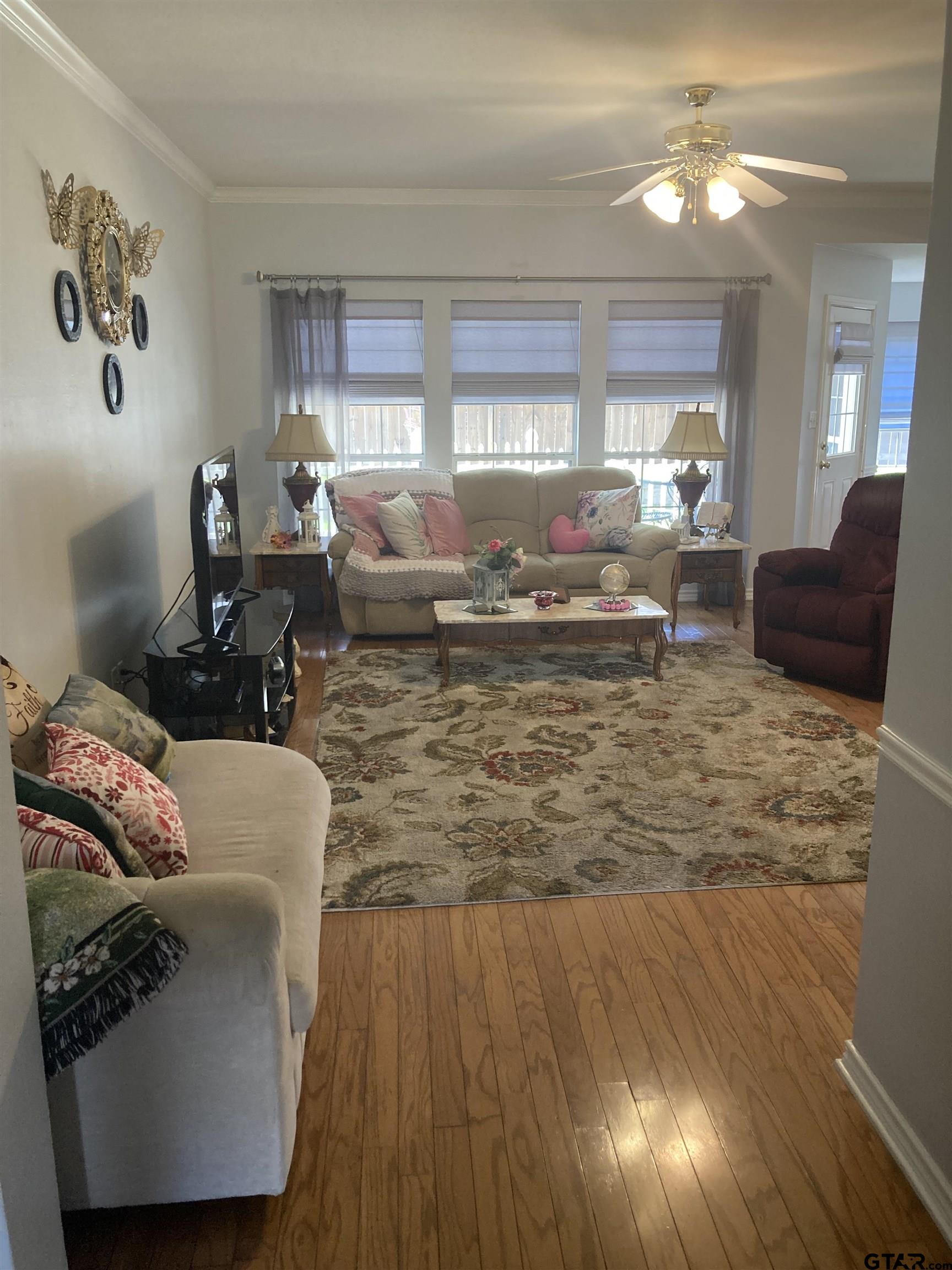 1521 Rice Road, Unit Q103 Tyler, TX 75703 - Photo 16 of 40 a living room with furniture and a large window