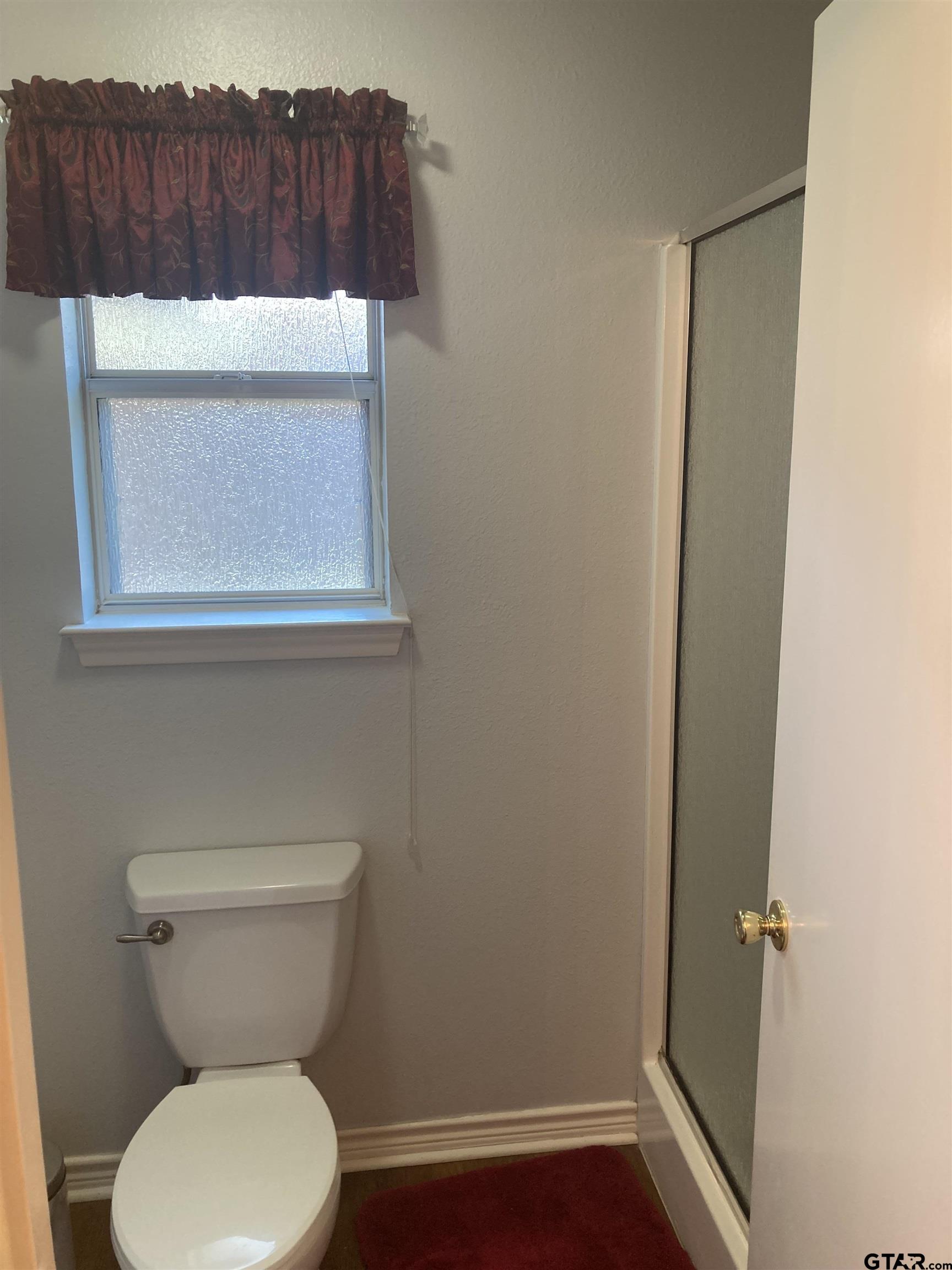 1521 Rice Road, Unit Q103 Tyler, TX 75703 - Photo 26 of 40 a bathroom with a toilet