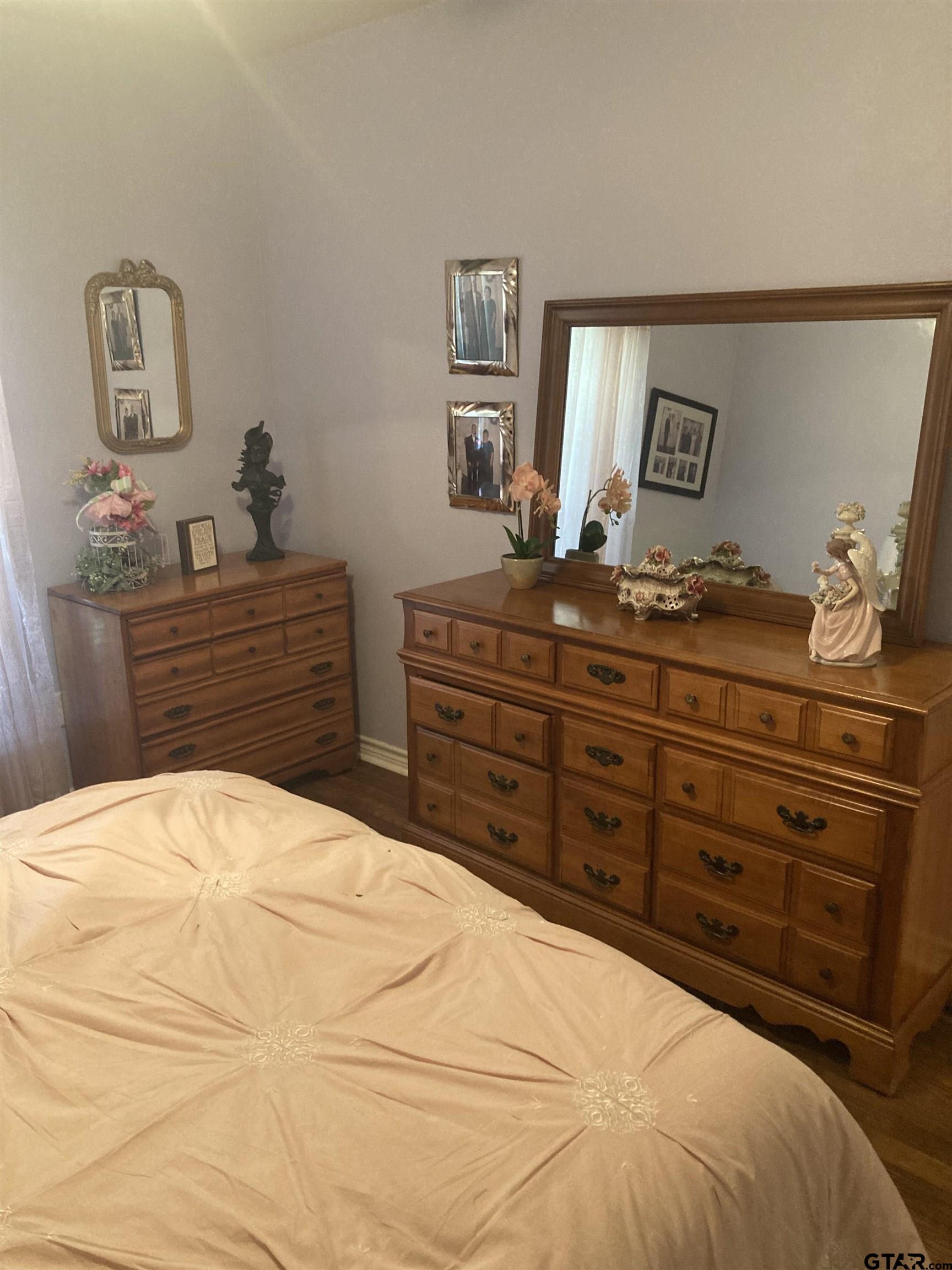 1521 Rice Road, Unit Q103 Tyler, TX 75703 - Photo 34 of 40 a bedroom with a bed and a dresser