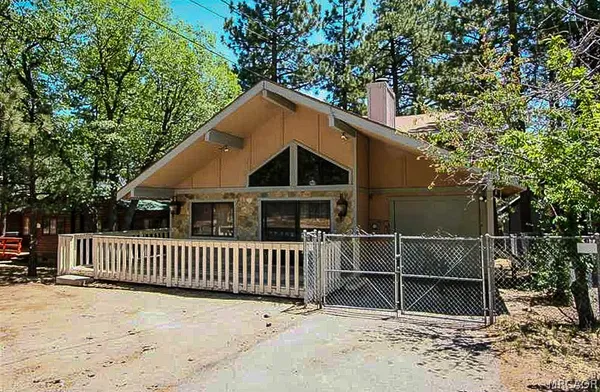 a backyard of a house with a garden