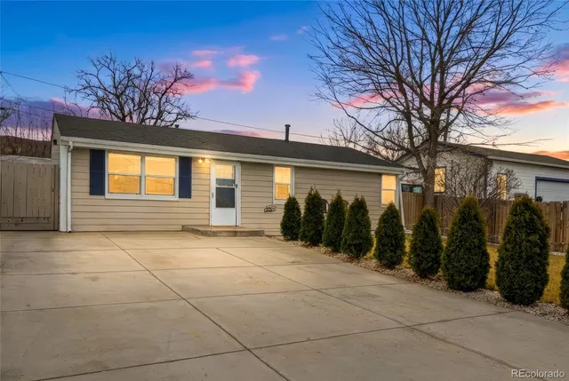 a view of a building with a backyard