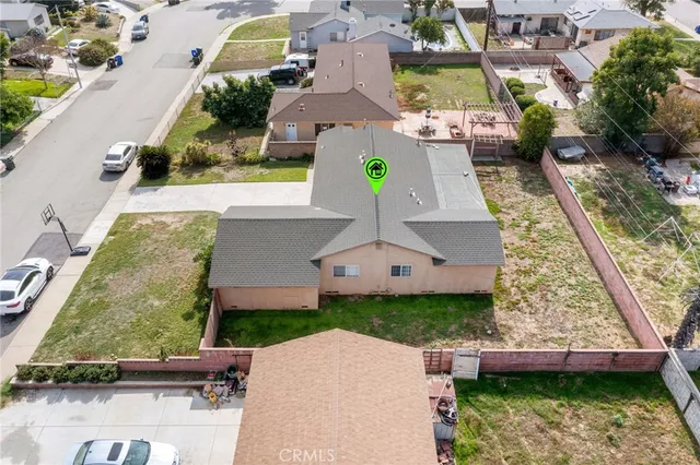 an aerial view of a house with a garden