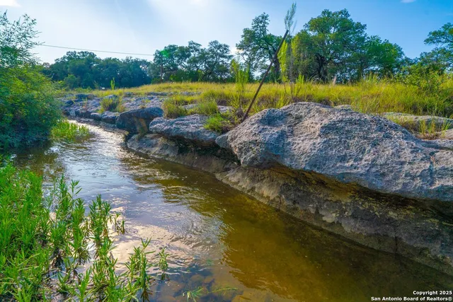 a view of a lake with houses in outdoor space