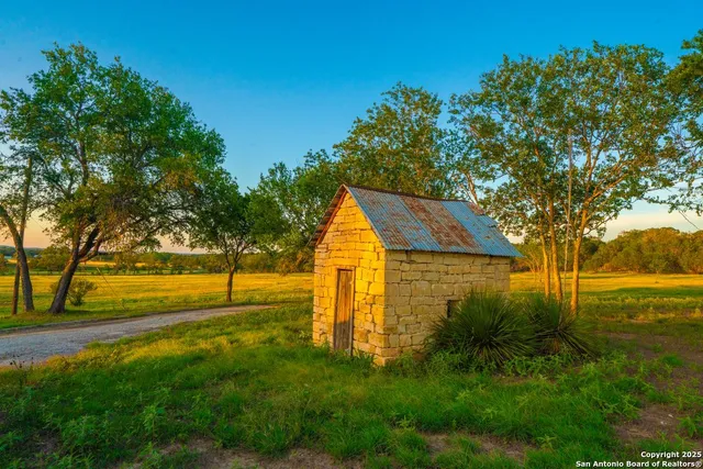 a yard with swimming pool and green space