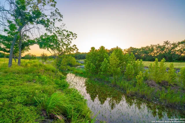 a view of lake with green space